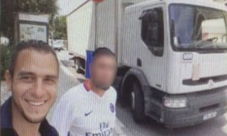 Lahouaiej-Bouhlel poses outside the truck with another man.