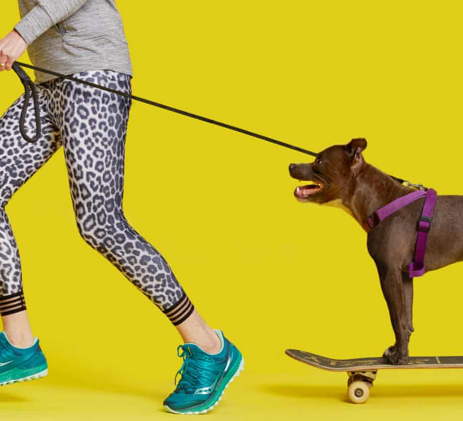 Zoe Williams running with dog on a skateboard