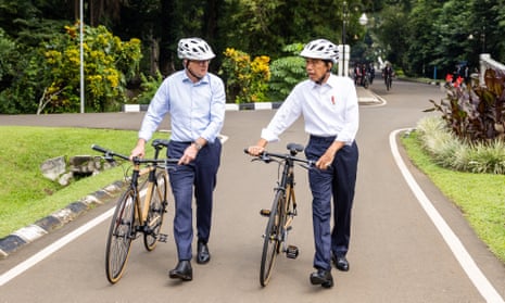 Anthony Albanese and Joko Widodo walking bicycles
