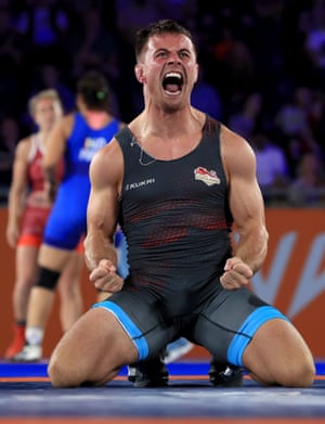 England wrestler Charlie Bowling celebrates victory over South Africa’s Arno van Zijl in the freestyle 74kg quarter-final.