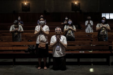 People attend a Eucharist at the Rio de Janeiro Metropolitan Cathedral in Rio de Janeiro, Brazil, on 4 July 2020.