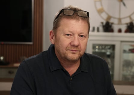 Jean-Pierre Lihou in a black shirt at home