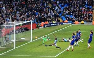 Fernandinho of Manchester City stretches as Kepa Arrizabalaga of Chelsea dives for for the ball as City beat Chelsea 6-0 at The Etihad Stadium.