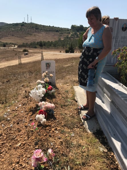 Silvana’s mother, Yllka, at the grave of her daughter, close to the family farm in the Fier district of Albania