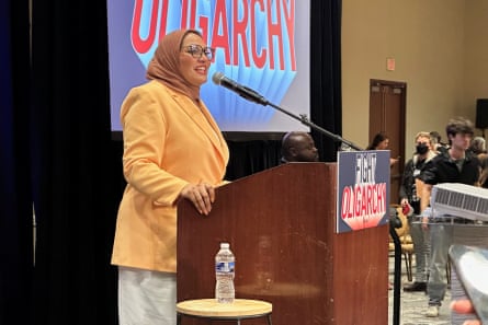 a woman speaks into a microphone
