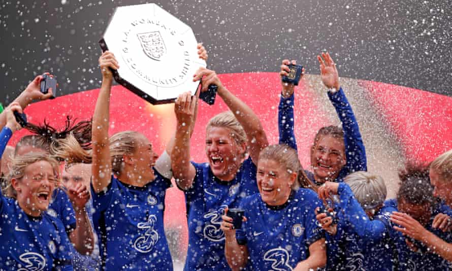 Chelsea’s Magdalena Eriksson and Millie Bright lift the trophy after winning the Community Shield against Manchester City in August 2020