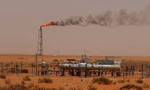A flame from a Saudi Aramco oil installion known as “Pump 3” is seen in the desert near the oil-rich area of Khouris, 160 kms east of the Saudi capital Riyadh, on June 23, 2008. 