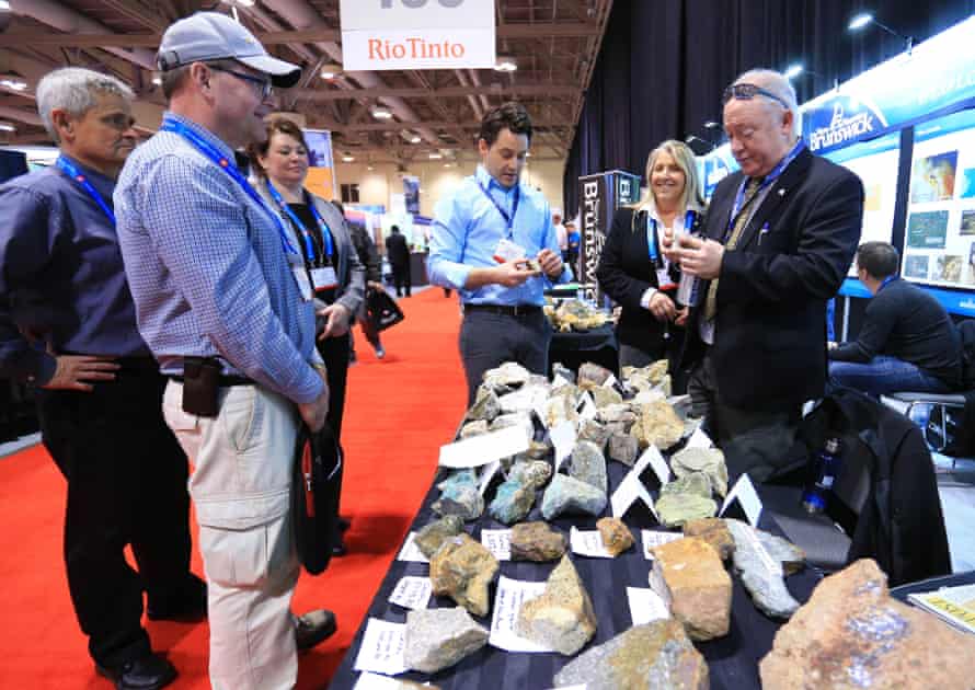 Visitors look at ore samples during the 2016 PDAC International Convention in Toronto.