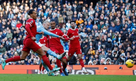 Manchester City's Erling Haaland scores a goal to make it 1-0 against Liverpool.