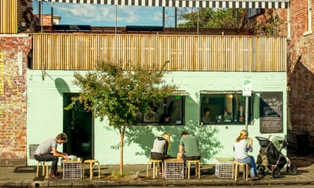 Diners sit outside a cafe in Melbourne's Richmond district.