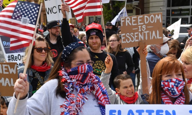 People take part in a ‘reopen’ Pennsylvania demonstration in Harrisburg, Pennsylvania, on 20 April. 