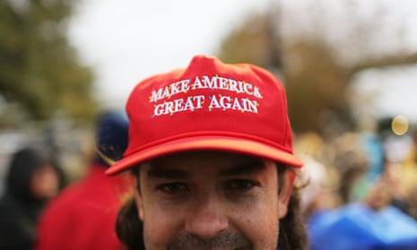 A Trump supporter waits to hear the president speak in Pensacola, Florida, on 8 December.