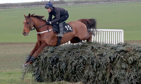 Definitly Red, seen here jumping the Aintree fence on the Malton Gallops, was a strong winner at Doncaster on Saturday.