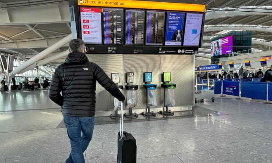 A passengers at Heathrow looks at a departure board after disruptions to BA flights from the airporr owing to ongoing technical issues last month. 