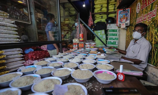 A rice wholesale trader awaits customers at his shop in Pettah, a commercial hub in Colombo, Sri Lanka.