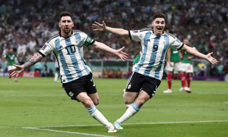 Lionel Messi celebrates with Julián Álvarez after opening the scoring against Mexico.