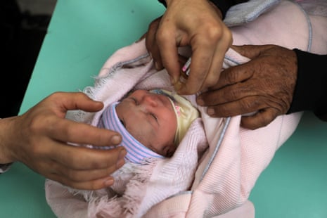 A Palestinian baby is vaccinated against polio, in Gaza City on Saturday.