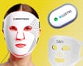 A woman wears a white LED face mask, alongside two other LED skincare devices