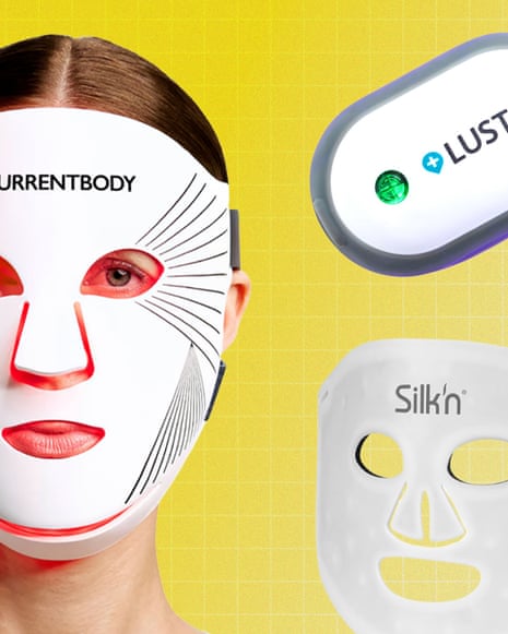A woman wears a white LED face mask, alongside two other LED skincare devices