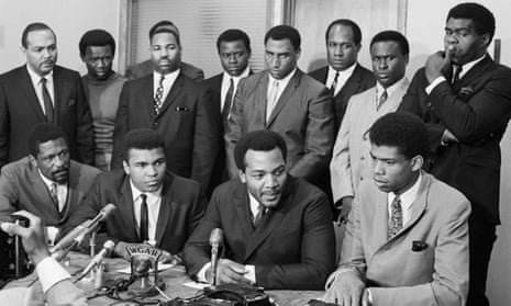 Kareem Abdul-Jabbar (front right) attends the Cleveland Summit alongside other prominent black athletes, such as Muhammad Ali, in 1967
