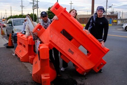 people hold barricades