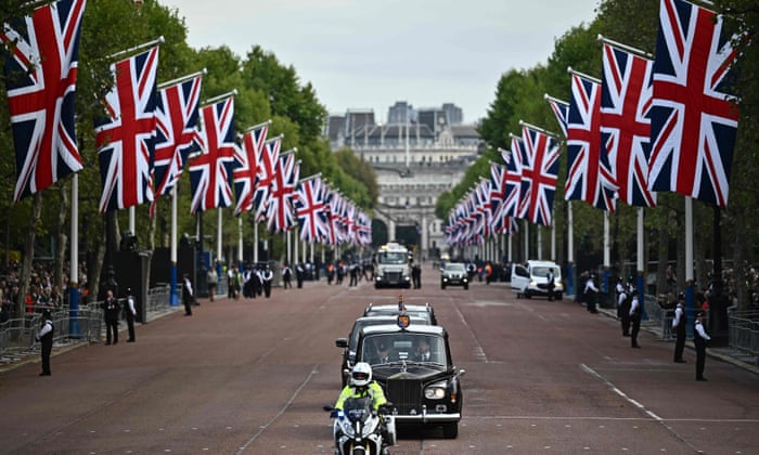 King Charles III is driven down the Mall to Buckingham Palace.