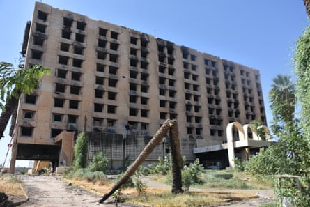 A large burnt-out hotel building