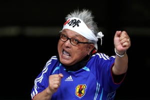 A Japan supporter cheers for the team.