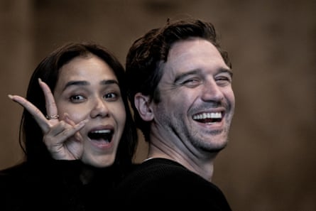 Michael and Adinia are smiling and looking at the camera. Adinia has her hands in a peace sign.