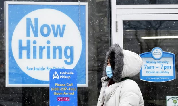 A ‘now hiring’ sign is seen in Schaumburg, Illinois. Women’s labor force participation – the percentage of women in or looking for work – had not been as low as it was in March (57.4%) since December 1988.