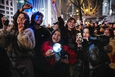 A group of fans from Brazil and Ukraine dance at the comeback concert at Gwanghwamun Square in Seoul