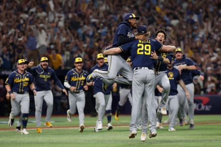 Trevor Megill, Christian Yelich and Abner Uribe embrace after Wednesday nightâÂÂs final out at Tropicana Field.