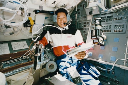 The astronaut Mamoru Mohri, wearing a headset to communicate with students and other ham operators during a mission in 1992.