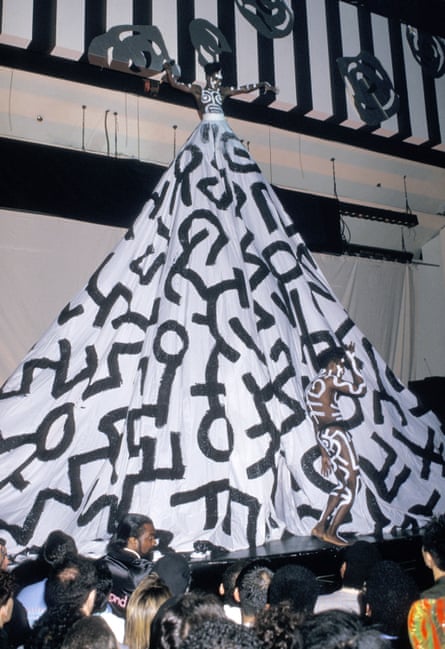 A woman wearing a huge oversized black and white skirt