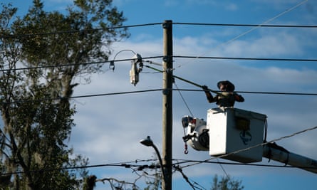 A lineman works to restore service in the aftermath of Hurricane Idalia in Perry, Florida.