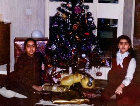 A young Kamin Mohammadi, right, with her sister Narmin and the family Christmas tree.