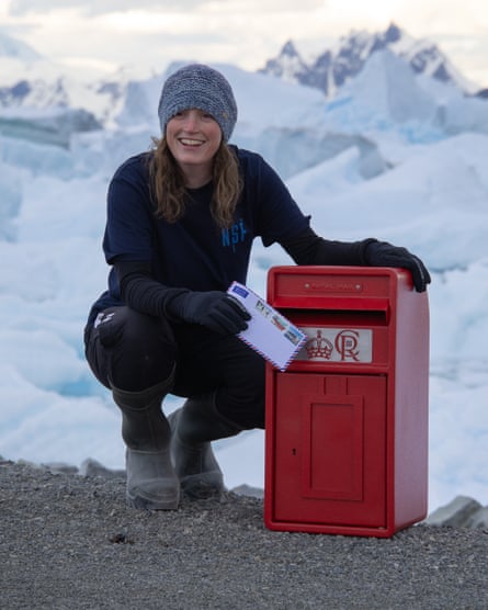 Kirsten Shaw with a letter by the postbox.