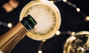 Champagne being filled into glasses, overhead view