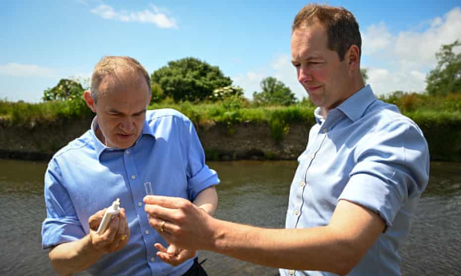 Richard Foord (right), the Lib Dem candidate in the Tiverton and Honiton byelection, with party leader Ed Davey as they test levels of phosphate in the water in the River Axe on Friday.