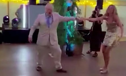 Boris Johnson dances in a linen suit at a wedding. More stylish looks are available.