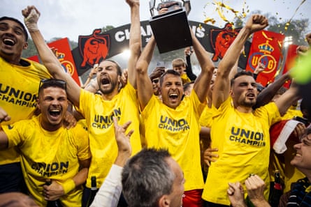 Union Saint-Gilloise celebrate ending their 90-year wait for the Belgian league title in May 2025, with Burgess third from the left.