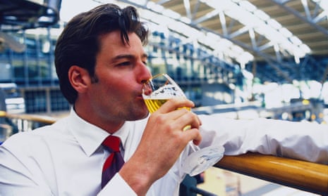 A businessman having a beer at airport