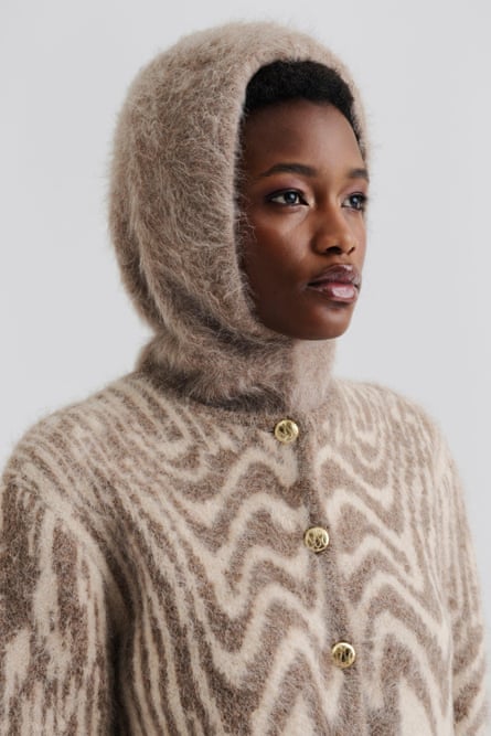 A modeling wearing a tan Balaclava