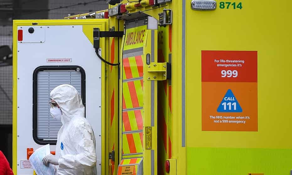 A paramedic wearing personal protective equipment (PPE) exits an ambulance outside St Thomas’ hospital in Westminster, London.