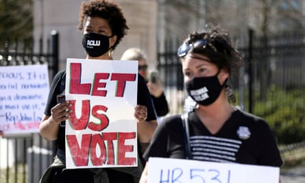 Demonstrators protest against voting restrictions in Atlanta, Georgia, on 4 March.