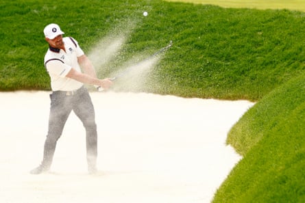Bryson DeChambeau hits out of the bunker during a round of 77.