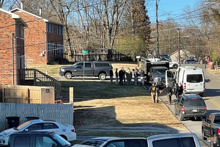Law enforcement officers gather outside a duplex house in Antioch, Tennessee, on 26 December.