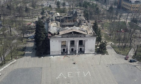 A theatre destroyed in Mariupol in March. The Russian word for “children” is written on the pavement.