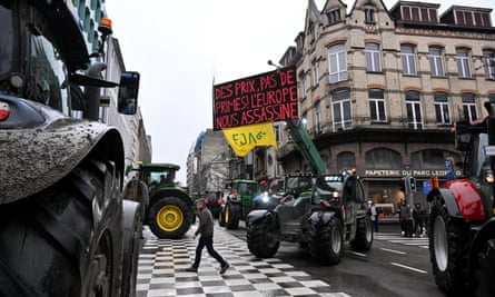 Tractors blocking road in city centre.