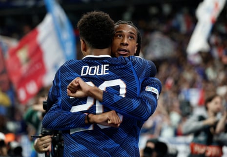 Michael Olise embraces Désiré Doué after scoring FranceâÂÂs third goal of the game